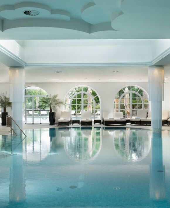 The large indoor pool by daylight at the Wellnesshotel Gut Ising on Lake Chiemsee.
